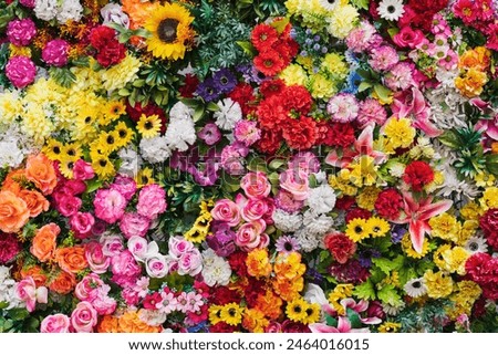 Photo background texture, wall of artificial flowers, photo wallpaper close-up. 