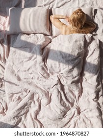 Photo Of A Beautiful Blond Woman Lying In A Linen Pastel Bedding Back To Us, She Has A Lot Of Cute Freckles On Her Back