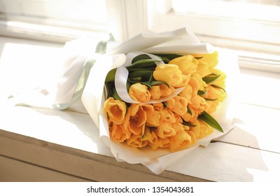 photo of beautiful bouquet of yellow tulips in paper packaging – Ảnh có sẵn
