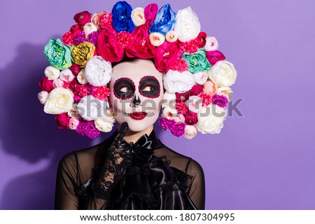 Photo of beautiful dead bride death day calaverita katrina facial tattoo zombie ornament look sly empty space floral headband black traditional costume isolated purple violet color background