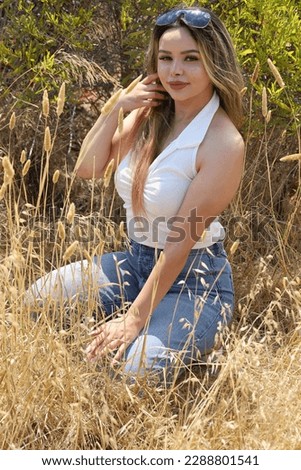 Similar – Young woman doing yoga in nature