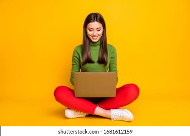 Photo of beautiful lady sitting floor holding notebook reading online lecture writing creative homework composition wear green sweater red trousers isolated yellow color background - Powered by Shutterstock