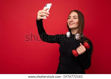 Similar – Brünette Frau, die mit einem Handy einen Fluss fotografiert.