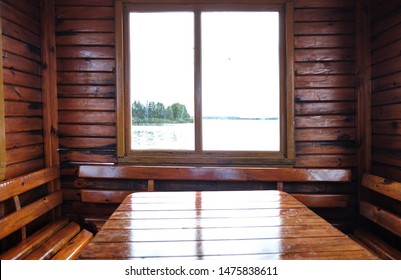 Photo Of A Beautiful River Wooden House In The Summer On The Lake. Inside View. Made In Nature.