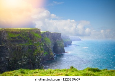 Photo Of Beautiful Scenic Sea And Mountain Landscape. Cliffs Of Moher, West Coast Of Ireland, Atlantic Ocean. View Of Ocean Scenery