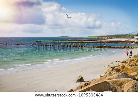 Photo of a beautiful scenic sea and sky landscape. View of ocean scenery. Beach and promenade, West coast of Ireland, Galway, Salthill, Atlantic ocean. Sea shore line