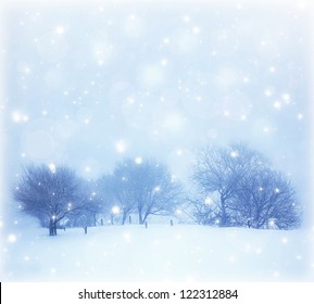 Photo of beautiful snowy landscape, Christmas postcard, snow cover on the trees, seasonal snowfall, snowstorm in cold winter day, frosty weather, hoarfrost on wood branches, wintertime panorama