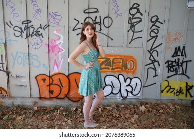 Photo Of A Beautiful White Girl In A Beautiful Dress, Near Graffitti