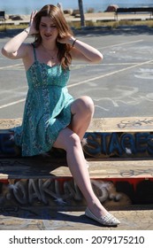 Photo Of A Beautiful White Girl In A Beautiful Dress, Near Graffitti