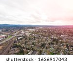 A photo of Beaverton, Oregon, USA, at sunset, a suburb. A photo from a height at sunset or sunrise. Design background