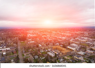 A photo of Beaverton, Oregon, USA, at sunset, a suburb. A photo from a height at sunset or sunrise. Design background