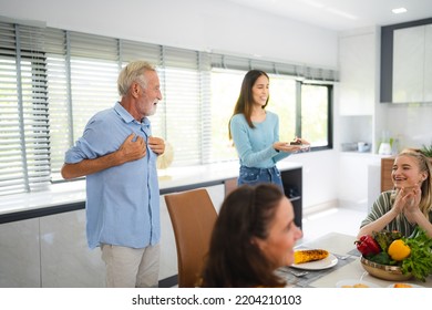 Photo Of Big Family At Home, People Sit Feast Dishes Table Around Roasted Turkey Multi-generation Relatives Making Group With Food And Pizza In House Living Room Indoors