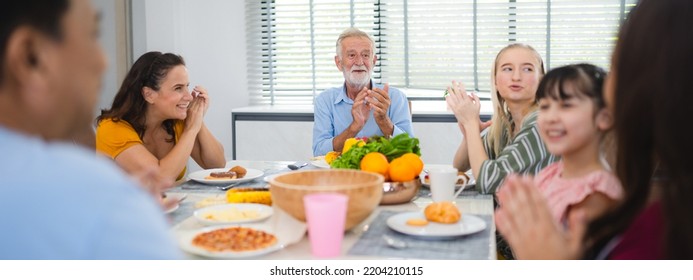 Photo Of Big Family At Home, People Sit Feast Dishes Table Around Roasted Turkey Multi-generation Relatives Making Group With Food And Pizza In House Living Room Indoors