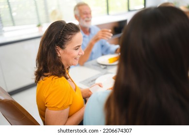 Photo Of Big Family At Home, People Sit Feast Dishes Table Around Roasted Turkey Multi-generation Relatives Making Group With Food And Pizza In House Living Room Indoors