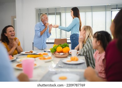 Photo Of Big Family At Home, People Sit Feast Dishes Table Around Roasted Turkey Multi-generation Relatives Making Group With Food And Pizza In House Living Room Indoors