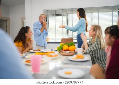 Photo Of Big Family At Home, People Sit Feast Dishes Table Around Roasted Turkey Multi-generation Relatives Making Group With Food And Pizza In House Living Room Indoors