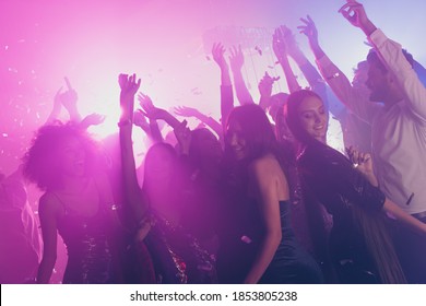 Photo of big group many fancy ladies dance have fun raise arms neon shiny spotlight modern club indoors