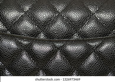 Photo of black handbag on the table.