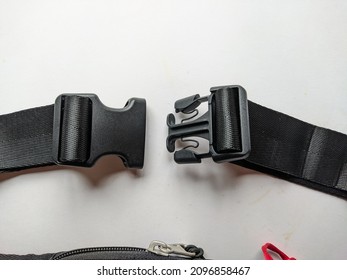 Photo Of Black Plastic Buckle On The Bag Strap
