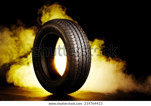 photo of black smoked\
and burning tire