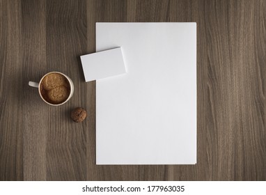 Photo blank a4 sheet and stack of b-cards with cape of coffee on a wooden texture - Shutterstock ID 177963035