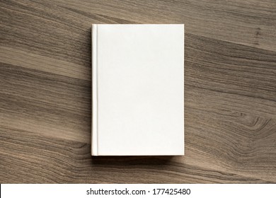 Photo blank book cover on textured wood background - Shutterstock ID 177425480