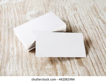 Photo of blank business cards with soft shadow on light wooden background. Blank template for your design. - Shutterstock ID 442081984