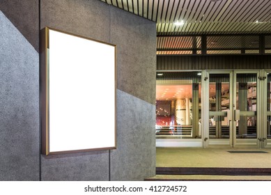 Photo Blank Mockup Of Event Poster Lightbox  Glowing On Concrete Wall At Night