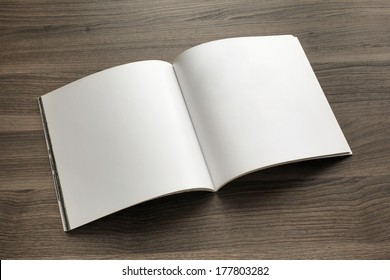 Photo blank. Open square format brochure on a wooden table - Shutterstock ID 177803282