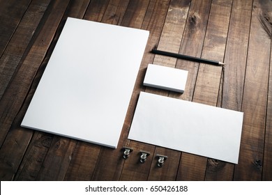 Photo Of Blank Stationery Set On Wood Background. Envelope, Business Cards, Pencil, And A4 Paper. Corporate Identity Template. Responsive Design Mockup.