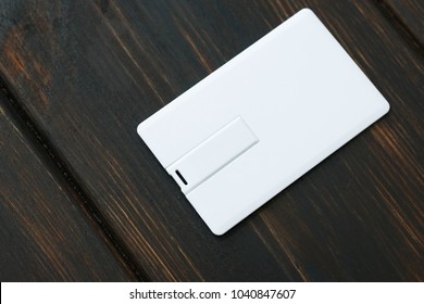 Photo Of Blank Usb Flash Card Cards. Blank Usb Flash Card On Wooden Table Background. Template For ID. Mockup For Branding Identity.