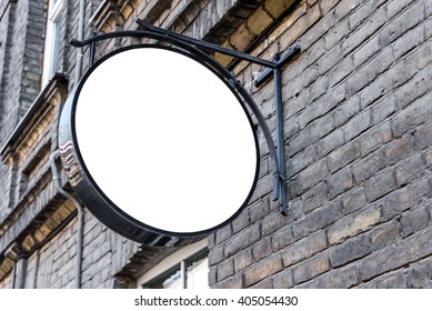 Photo blank white mockup of street store vintage signboard on an old yellow brick wall