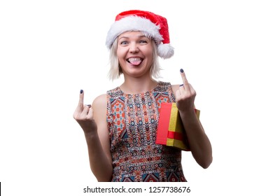 Photo Of Blonde In Glasses And Santa's Cap With Tongue Hanging Out And Gift Under Arm