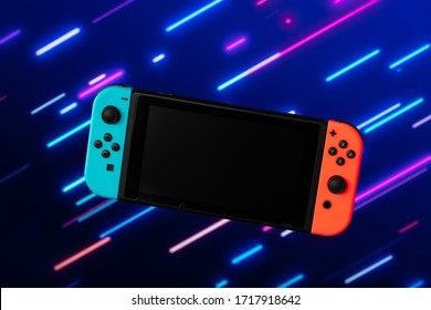 Photo of blue and orange video game console