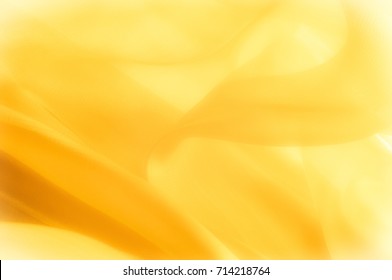 The photo is blurred. Texture, background, pattern. Yellow silk fabric. Abstract background of luxury Yellow fabric or liquid wave or wavy grunge texture. The whole background. - Shutterstock ID 714218764