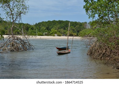 Photo Of A Boat Found In A Stream Located On A Beach On The Island Of Marajó, Brazil.