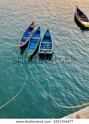 Photo of boats while golden hour.
