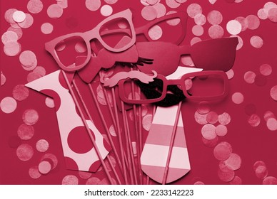 Photo booth props glasses, mustache, lips on a pink background flat lay. New 2023 trending PANTONE 18-1750 Viva Magenta color - Powered by Shutterstock