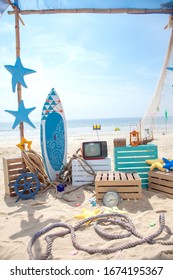 Photo Booth Setup On Beach. Summer, Surfing And Fishing Theme For An Event Party Or Birthday. 