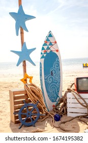 Photo Booth Setup On Beach. Summer, Surfing And Fishing Theme For An Event Party Or Birthday. 