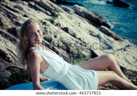 Similar – Young, slender, long-legged woman on a Baltic beach in a summer dress