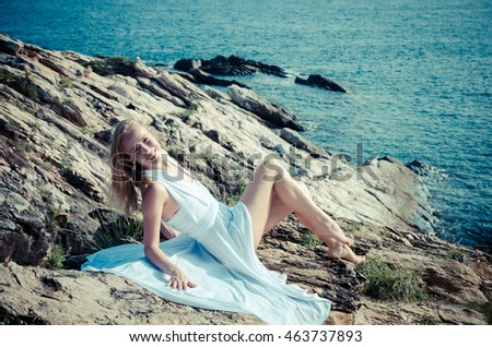 Similar – Young, slender, long-legged woman on a Baltic beach in a summer dress