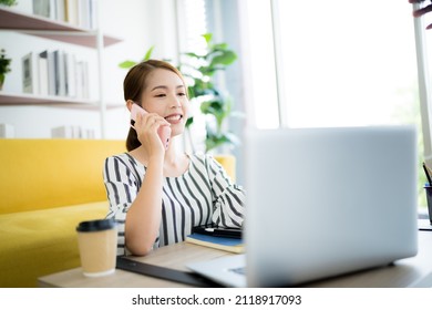 A Photo Of A Bright Asian Business Woman Working At Home In The Room. The Idea Is Work Form Home Finance Marketing Bright Portrait Simple