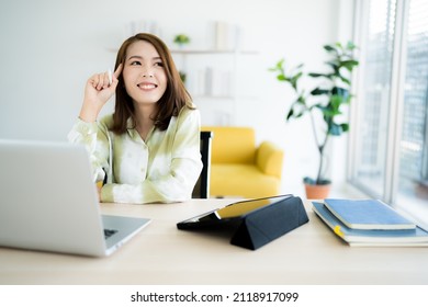 A Photo Of A Bright Asian Business Woman Working At Home In The Room. The Idea Is Work Form Home Finance Marketing Bright Portrait Simple