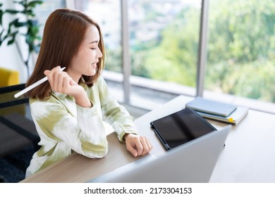 A Photo Of A Bright Asian Business Woman Working At Home In The Room. The Idea Is Work Form Home Finance Marketing Bright Portrait Simple Break The Science Bias