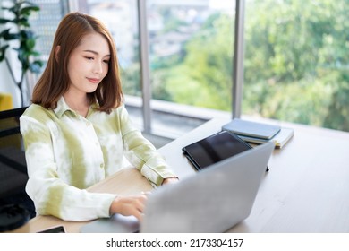 A Photo Of A Bright Asian Business Woman Working At Home In The Room. The Idea Is Work Form Home Finance Marketing Bright Portrait Simple Break The Science Bias