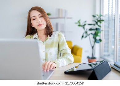 A Photo Of A Bright Asian Business Woman Working At Home In The Room. The Idea Is Work Form Home Finance Marketing Bright Portrait Simple Break The Science Bias