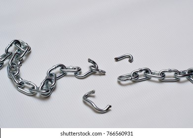 Photo Of Broken Metallic Chain On White Background