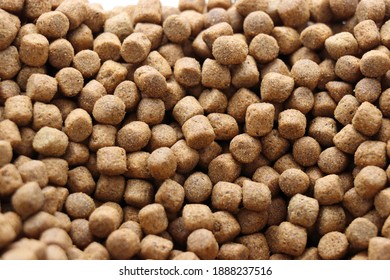 Photo Of Brown Pet Koi Fish Food Pellets