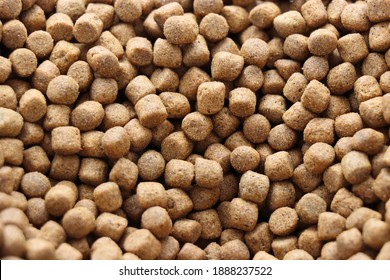 Photo Of Brown Pet Koi Fish Food Pellets